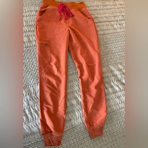 XS FIGS joggers in terra cotta